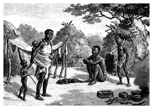 istock San semi-nomadic  hunter-gatherer people called also Bushmen from the Kalahari desert live in poverty in mud huts around a permanent waterhole. Women have a high status and are greatly respected. 1872150706