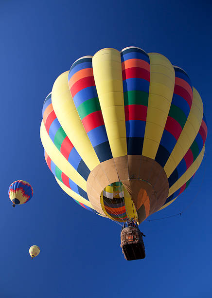 istock Hot air balloons flying overhead 187216095