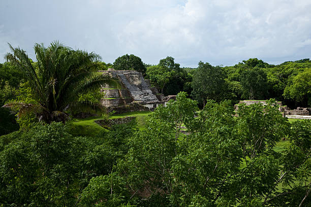 man's shoes overlooking xunantunich maya site ruins in belize caribbean