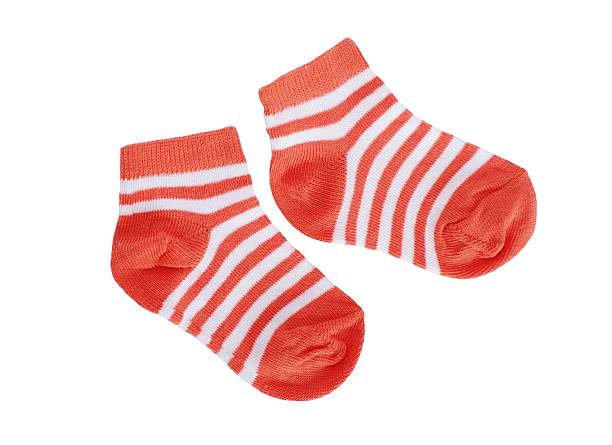 istock orange striped baby socks 187219275