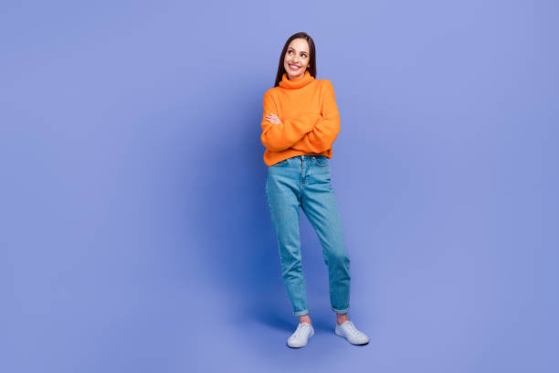 istock Full body photo of charming girlfriend model folded hands look empty space thinking about her business isolated on purple color background 1872198395