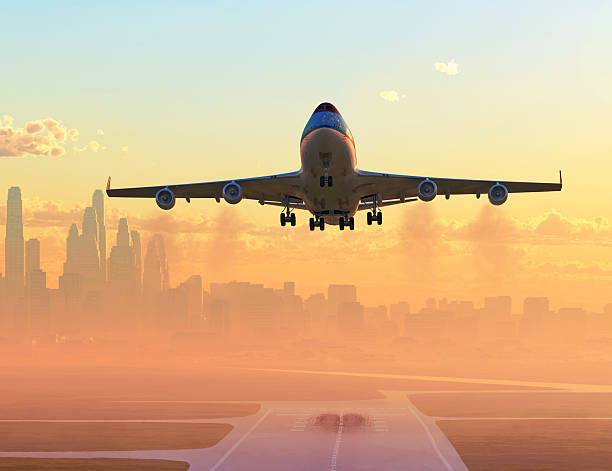 istock airplane taking off at sunrise 187221287