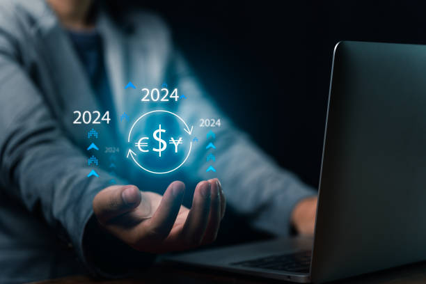 istock Currency Dynamics Businessman's Hand Showcases Virtual Screen Displaying 2024 Exchange Rates Increase 1872214379