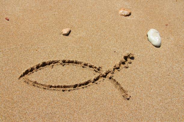Christianity fish sign in sand