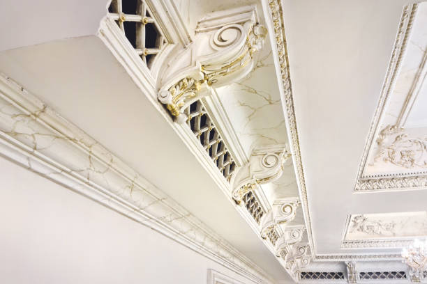 istock White plaster molding elements with gold veins for decorating the ceiling in a classic style 1872214764