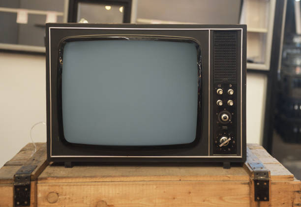 An old TV sits on a box. Retro technology concept.