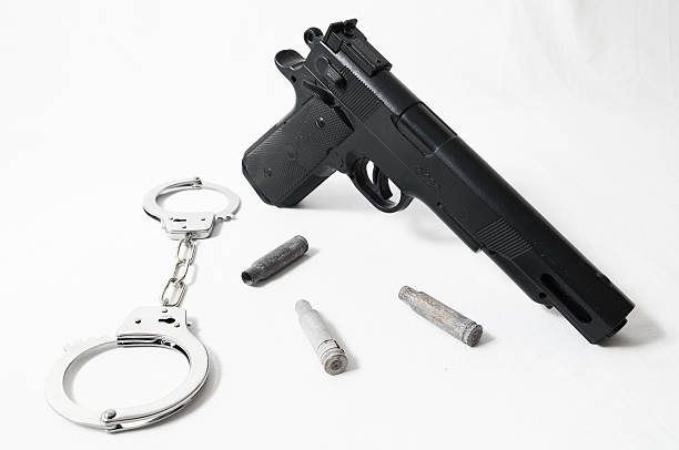 istock Pistol Gun and Handcuffs 187222854