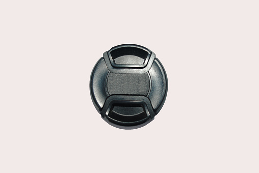 Isolated image of camera lens cap.