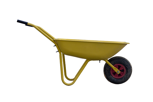 Yellow wheelbarrow is a tool in the construction site or garden isolated on a white background included clipping path.