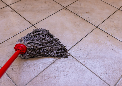 Mop cleaning a dirty floor