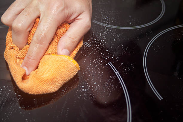 istock Cleaning cook top stove. 187227194