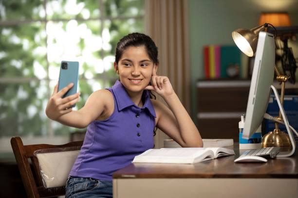 istock Student girl with computer learning at home stock photo 1872294765