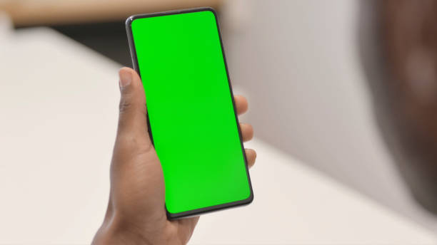 istock Close up of African Man Using Smartphone with Green Screen 1872316839