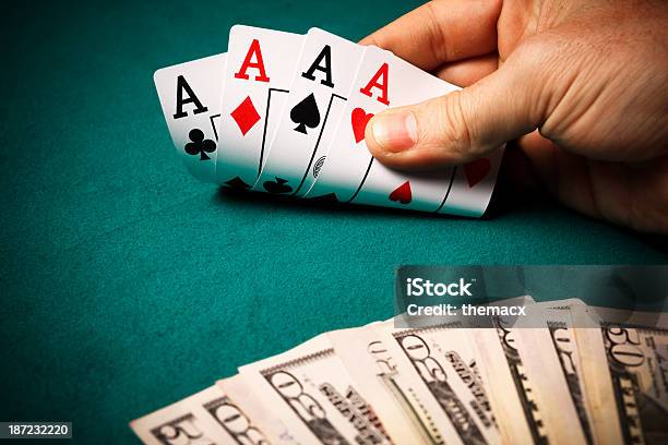 Hand Of Aces And Dollar Stock Photo - Download Image Now - Ace, Ace Of Clubs, Ace Of Diamonds