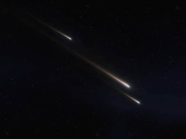 istock Shooting stars in the night sky. Three falling meteors. 1872331984