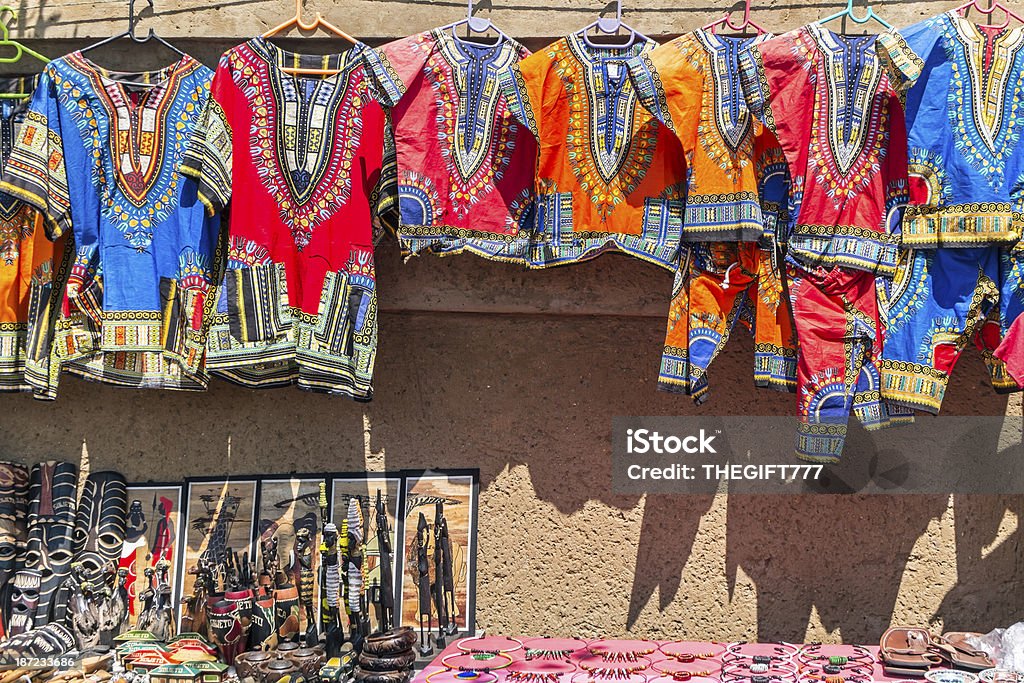 African Curios and clothing African Curios and clothing hanging on the wall. Soweto Stock Photo