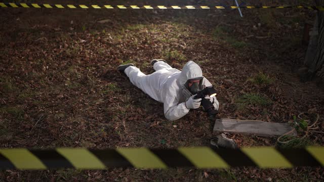 Forensic scientist photographing evidence