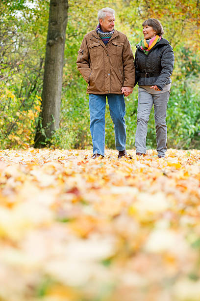 istock Senior couple walking outdoors in autumn 187235078