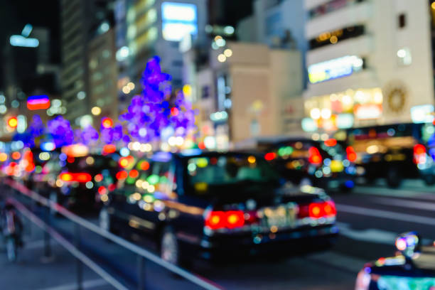 istock De focused, Blurred image of traffic lights. Abstract bokeh traffic background. 1872354167