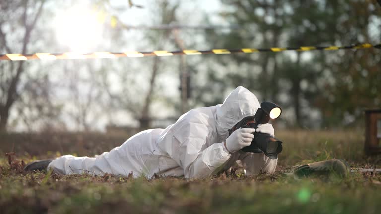 Forensic scientist photographing evidence