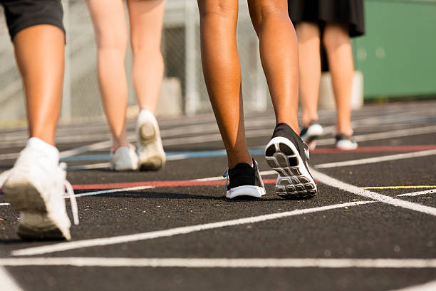 istock Sports:  Women exercise by walking around a track. 187235914