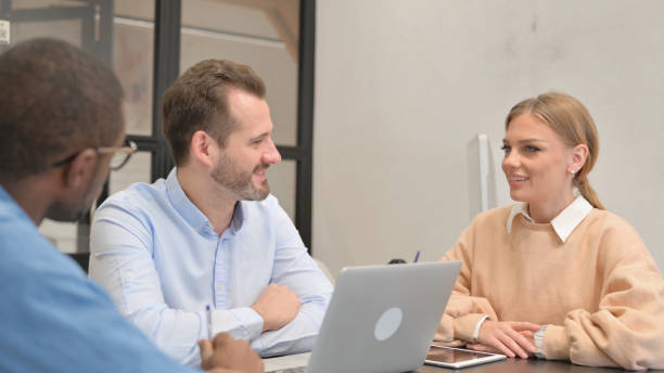 istock Confident Young Business People Talking in Office 1872362186