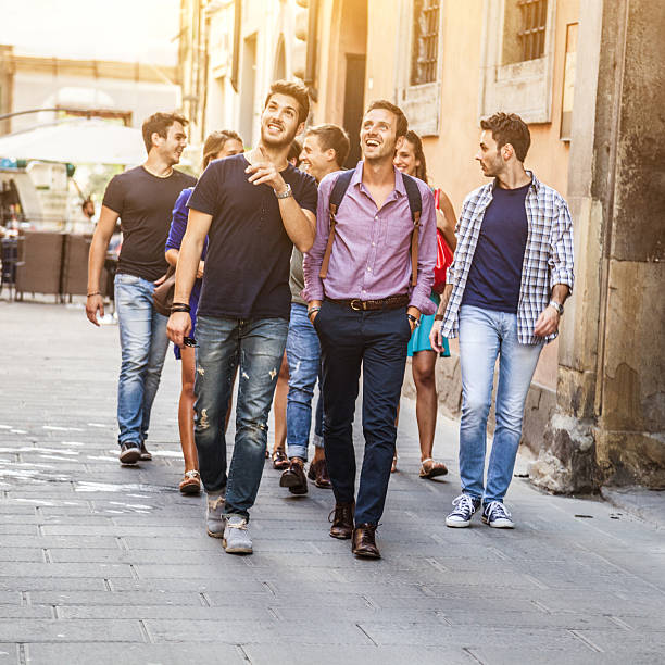 istock Group of happy students walking on the street 187236301