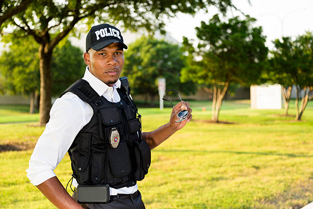 istock Law:  Policeman removes sunglasses during interrogation. 187236666