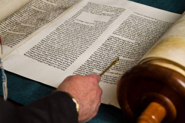 istock Close-up View of Torah Reading with Yad in Synagogue 1872373305