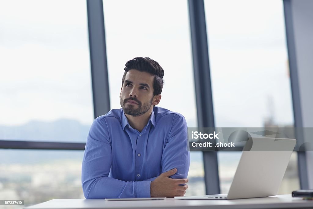 happy young business man at office happy young business  man work in modern office on computer Adult Stock Photo