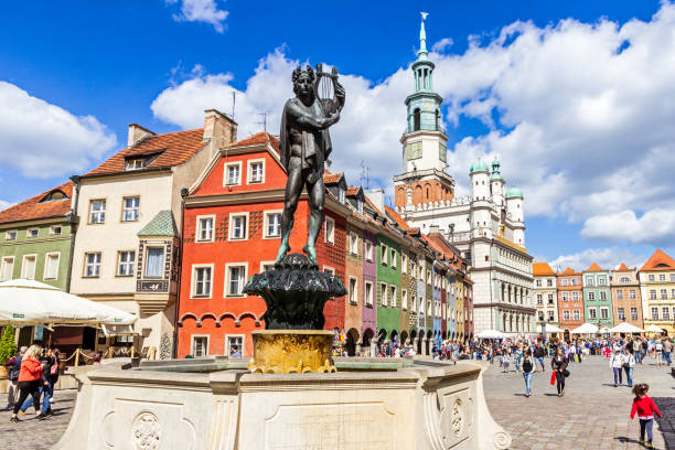 Orpheus statue fountain on the colorful touristic main square in the city centre. Poznan, Poland - August 20, 2014