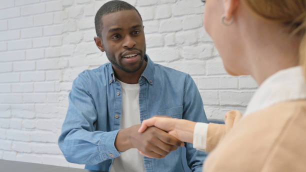 istock Young People Shaking Hand after An Agreement 1872400099