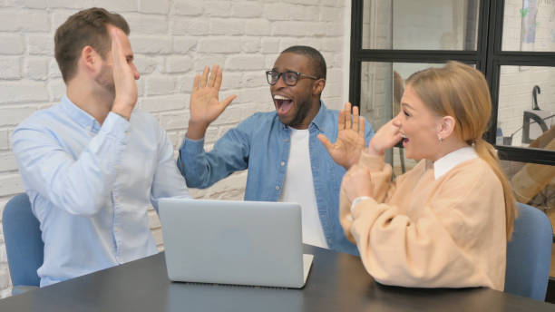istock Excited Multi Ethnic People Celebrating Online Success 1872401657