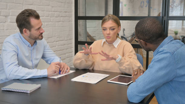 istock Young Female Talking with Multi Ethnic Teammates 1872403810