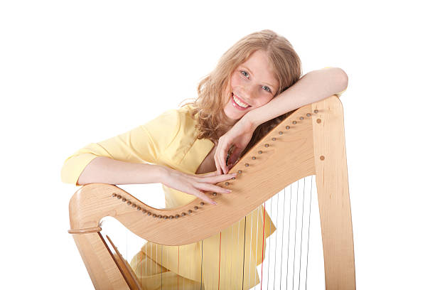 istock smiling young woman and harp 187240465