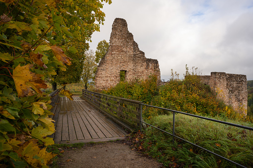 Gerolstein, Germany - October 22, 2023: Panoramic image of old Gerolstein castle in foggy light during autumn on October 22, 2023 in Eifel, Rhineland-Palatinate, Germany