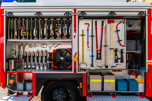Riva del Garda, Italy - October, 1. 2023:  Close up of firefighters equipment in a fire engine.