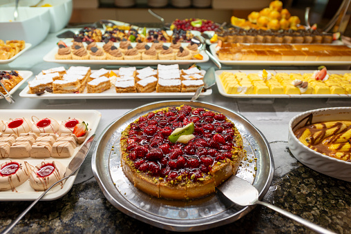 Turkish small cakes. Traditional Turkish delight in the hotel buffet in Turkey. Antalya region, South Turkey