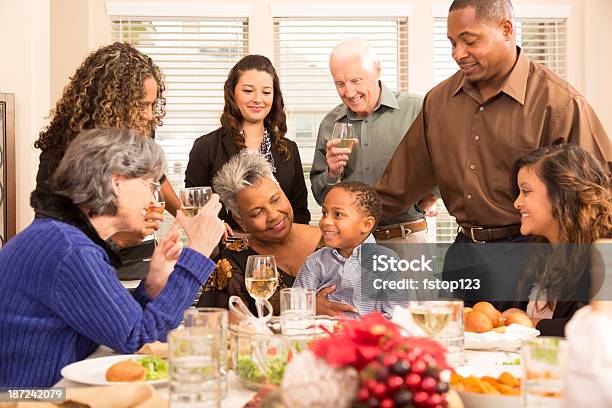 Relationships Family Friends Gather For Christmas Dinner Or Holiday Party Stock Photo - Download Image Now