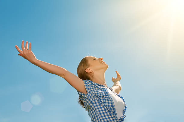 istock A happy young woman with her arms outstretched 187242592