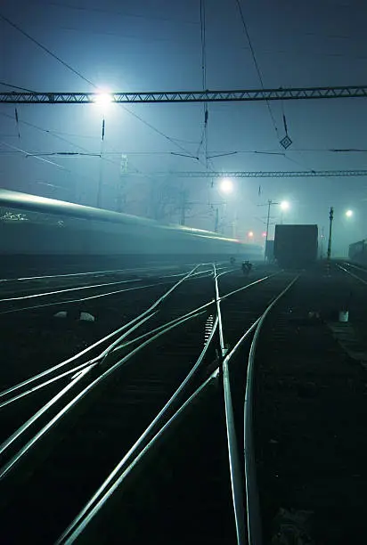 Railway station in the night. Tone is blue