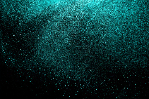 Black dark blue golden shiny glitter abstract background with space. Twinkling glow stars effect. Like outer space, night sky, universe. Rusty, rough surface, grain.
