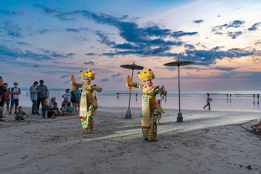 DENPASAR BALI INDONESIA - October 10, 2023: Balinese dancers at the ocean cleansing ceremony