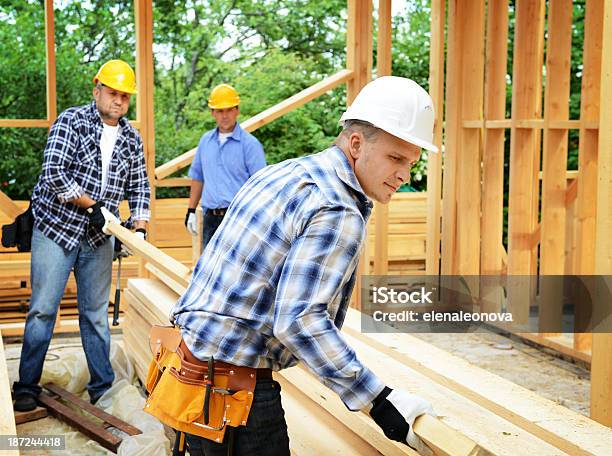 Construction Workers Stock Photo - Download Image Now - Heavy, People, Picking Up