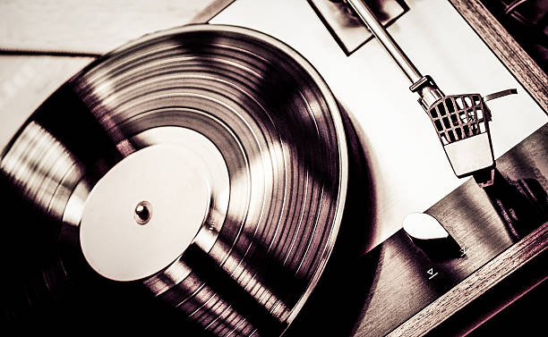 istock Close up of a vintage turntable playing an LP record. 187244422