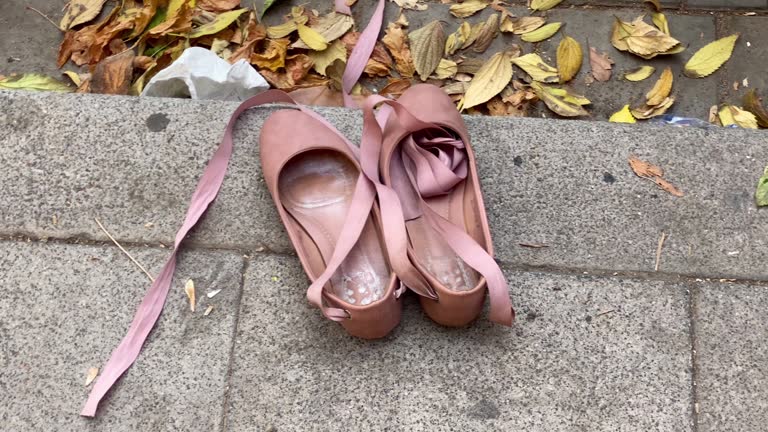 Abandoned woman shoes on the sidewalk