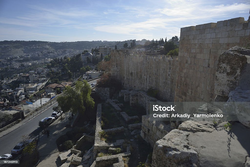 Jerusalem. Walls of the Old City. View from walls of the Old City. The ruins at the wall foot. Urban buildings on background. Jerusalem Stock Photo