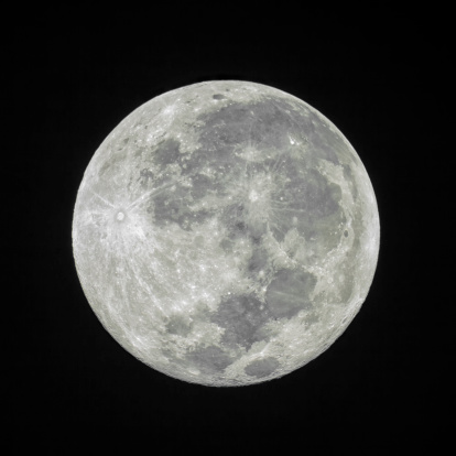 Full moon isolated on black night sky background