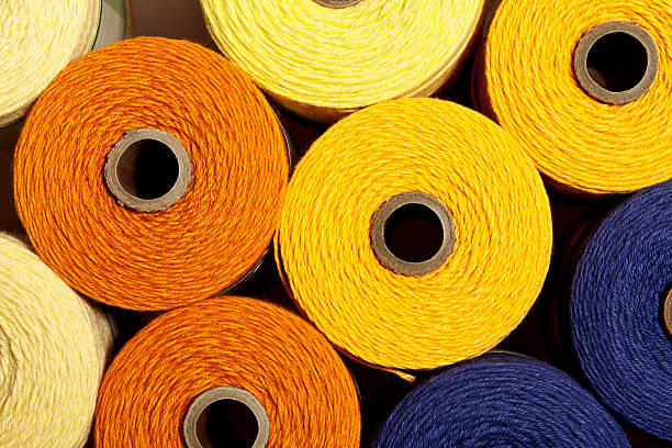 istock Bins filled with colorful spools of yarn. 187246462