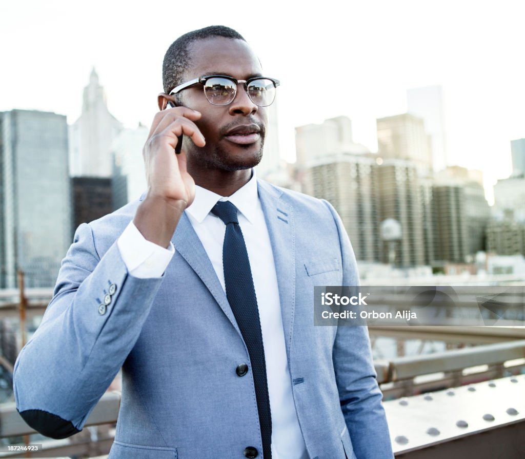 Businessman talking on the phone Businessman talking on the phone in New York City 20-29 Years Stock Photo